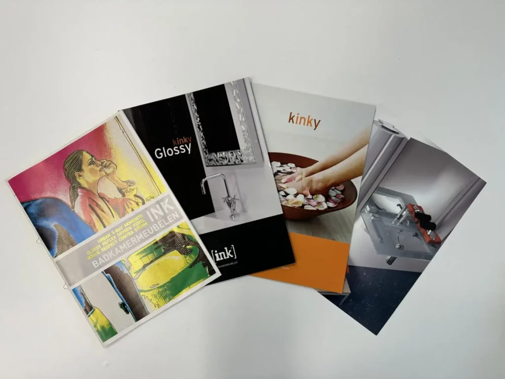 a group of magazines on a white surface