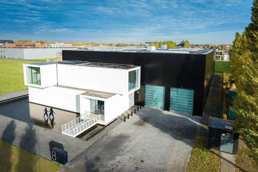 a building with a black wall and a black garage